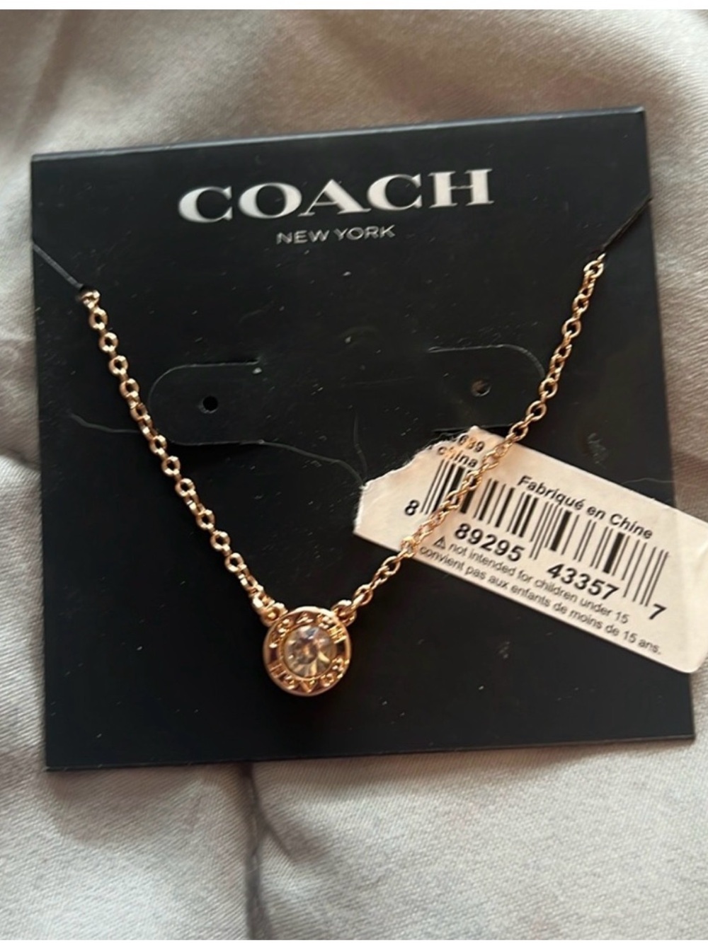 Coach Rose Gold Crystal Medallion Necklace